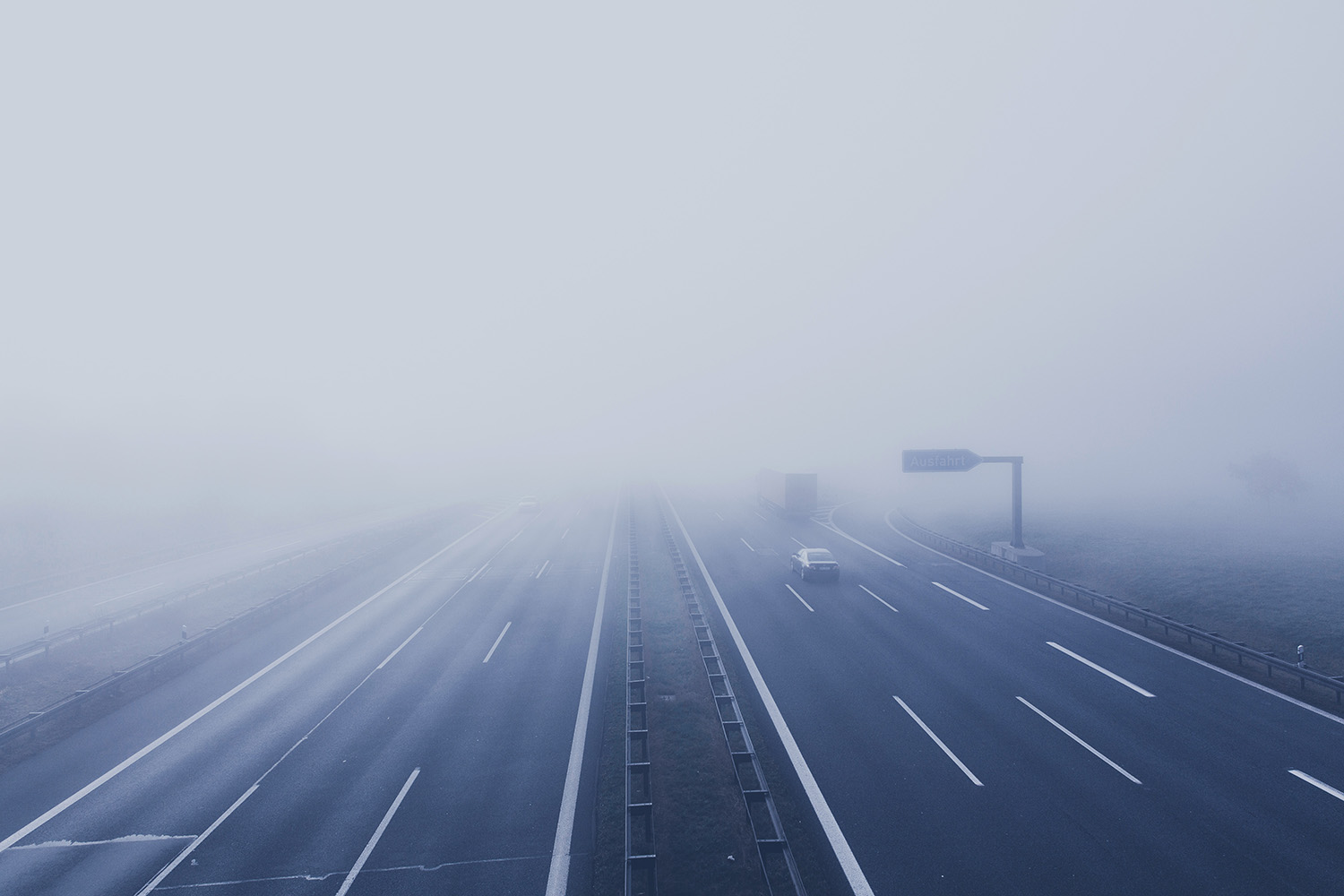 icy road covered in fog